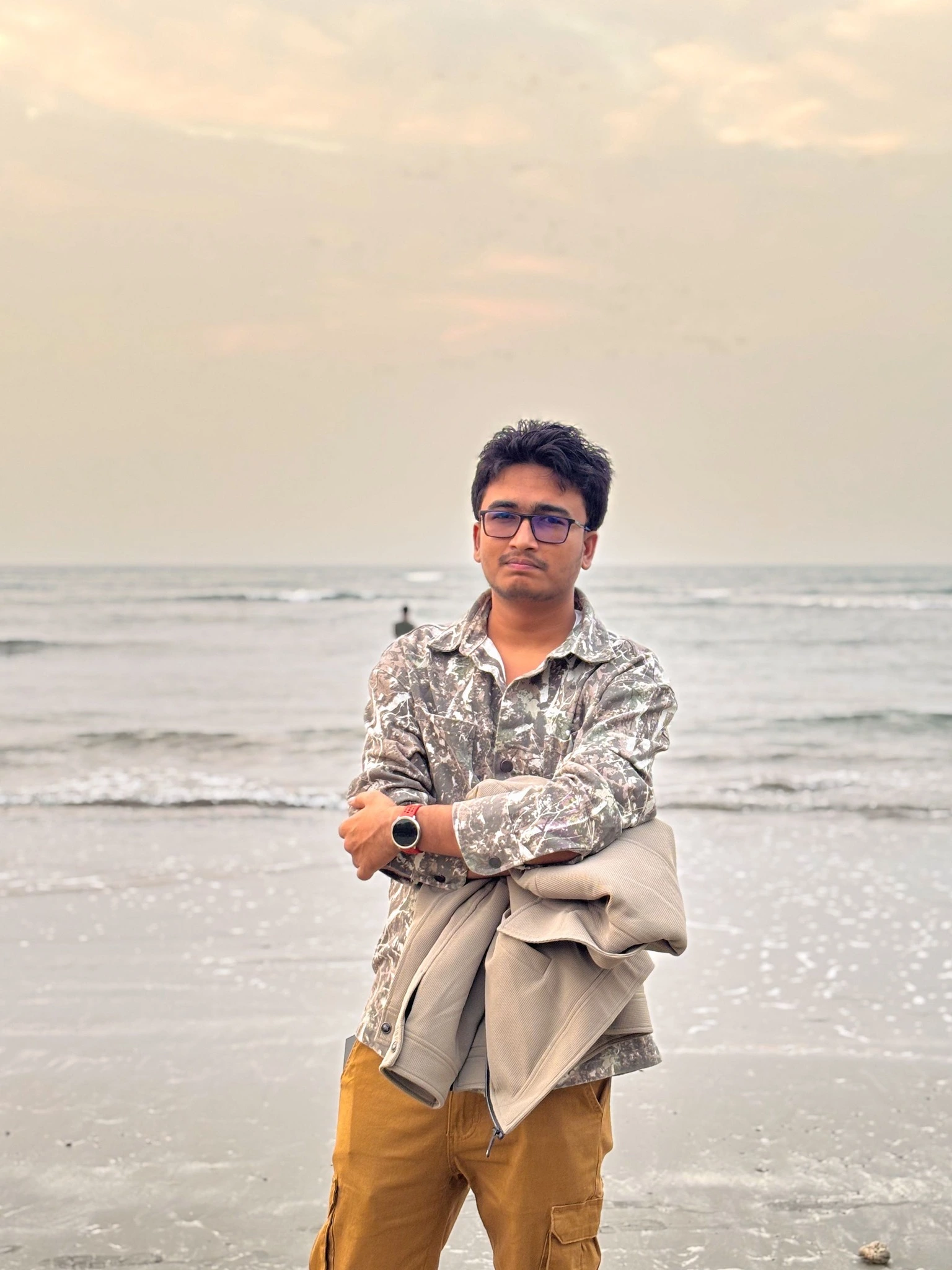 Confident portrait on beach at sunset